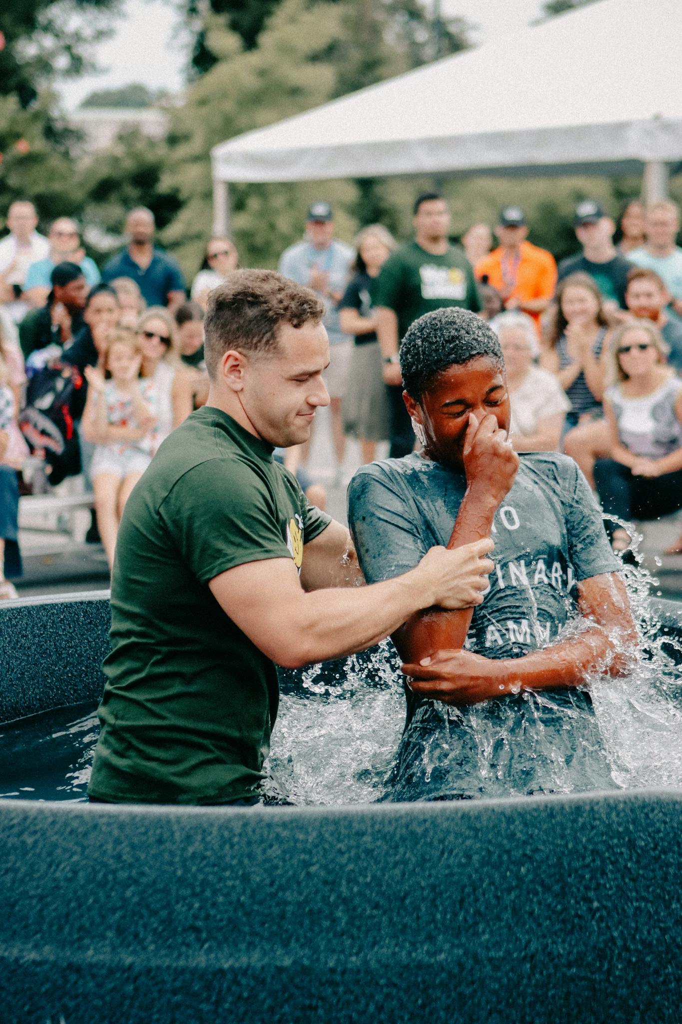 Vibrant baptism scene at an outdoor church gathering in Clemson, South Carolina.